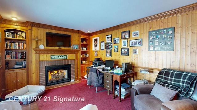 office space featuring carpet floors, wooden walls, a fireplace, and built in features