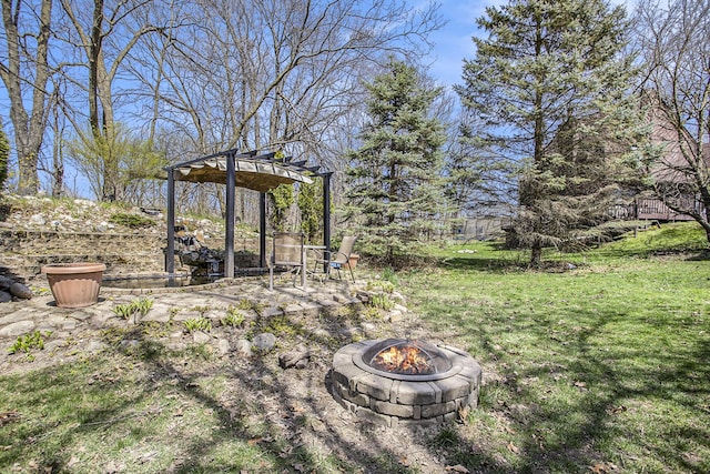 view of yard with an outdoor fire pit and a pergola