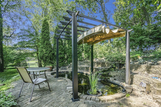 view of patio with outdoor dining area, fence, and a pergola