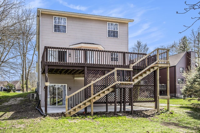 rear view of property with a deck and stairway