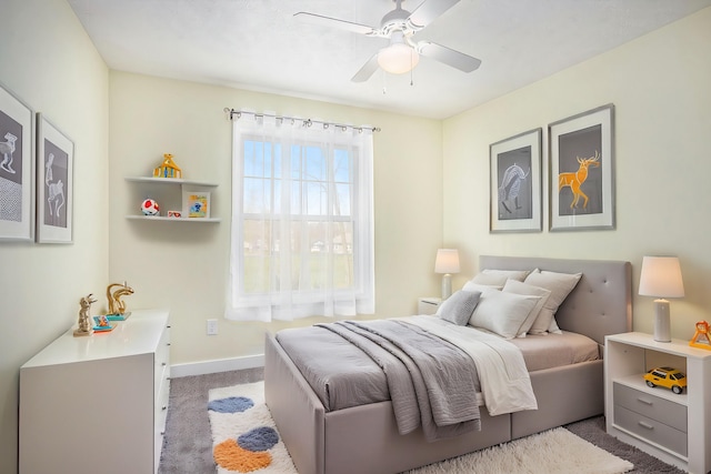 bedroom with ceiling fan, carpet floors, and baseboards