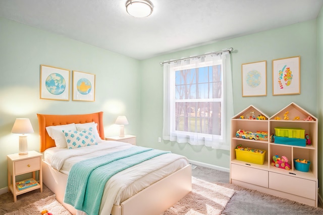 carpeted bedroom with baseboards