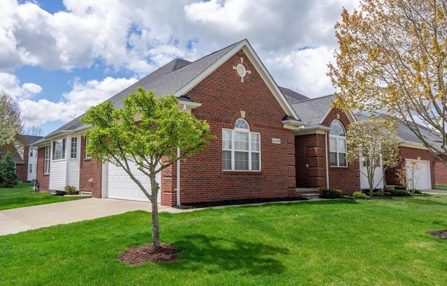 view of front of property with brick siding, an attached garage, driveway, and a front yard