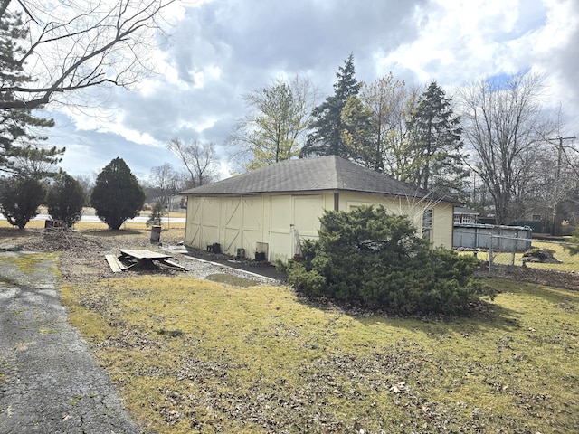 7993 Church Rd, Grosse Ile, MI 48138 - view of property exterior with a yard and fence