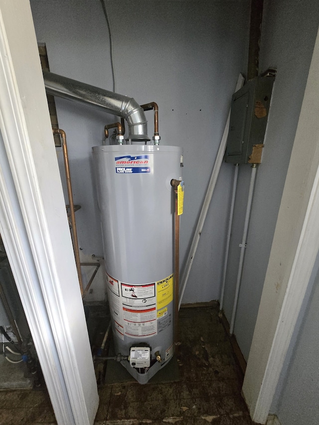 7993 Church Rd, Grosse Ile, MI 48138 - utility room with electric panel and water heater