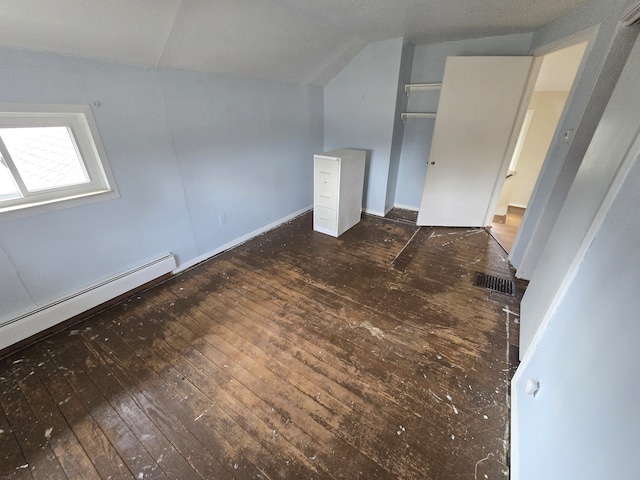 7993 Church Rd, Grosse Ile, MI 48138 - additional living space featuring a baseboard radiator, lofted ceiling, visible vents, and hardwood / wood-style flooring