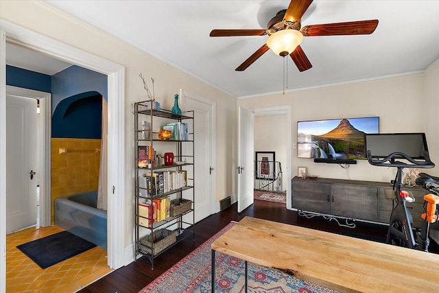 home office featuring wood finished floors and ceiling fan