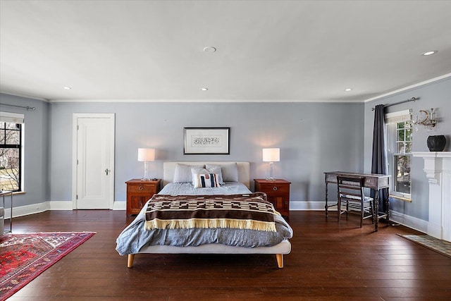 bedroom with multiple windows, baseboards, and hardwood / wood-style floors