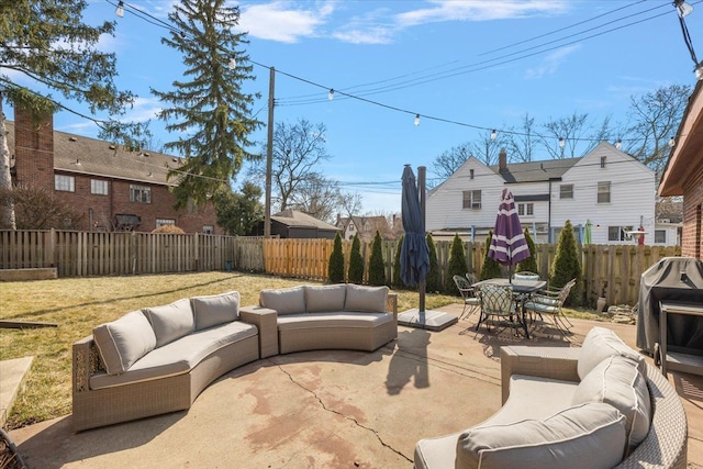 view of patio with an outdoor hangout area, outdoor dining area, and a fenced backyard