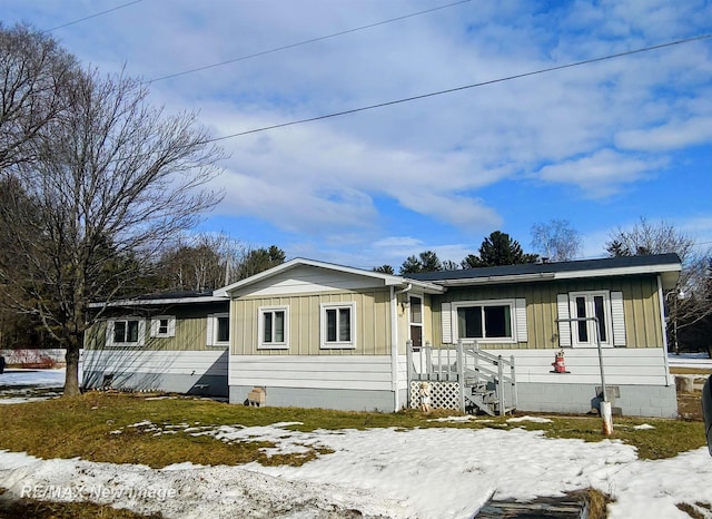 view of front of home featuring crawl space and board and batten siding