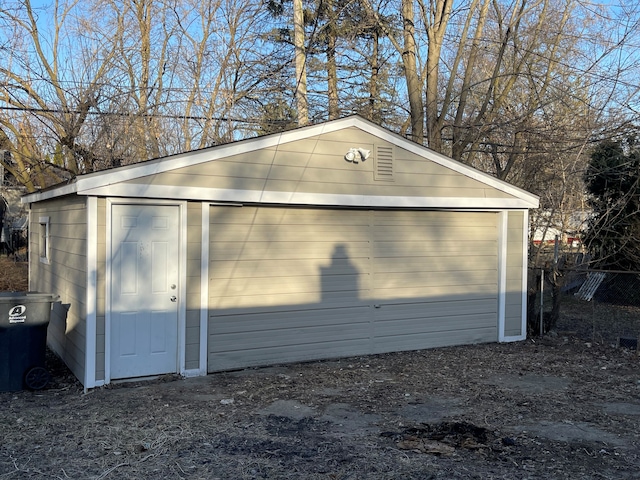 detached garage with fence