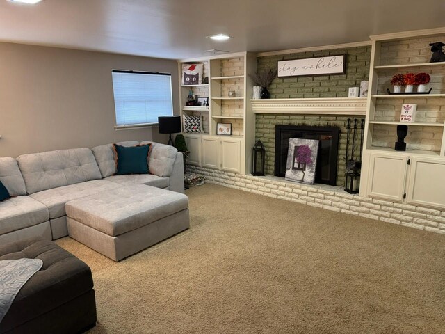 carpeted living area with a brick fireplace