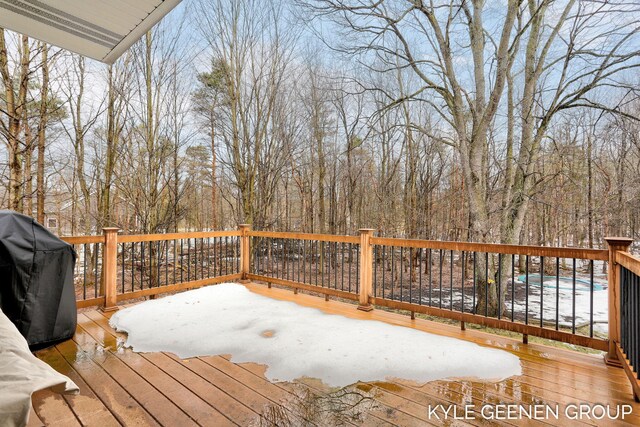 wooden terrace with area for grilling