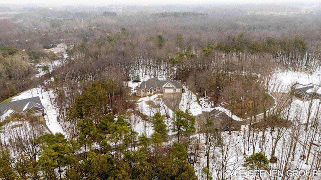 snowy aerial view with a view of trees