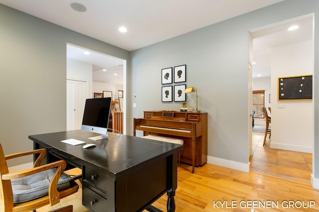 office space with light wood-style floors, baseboards, and recessed lighting