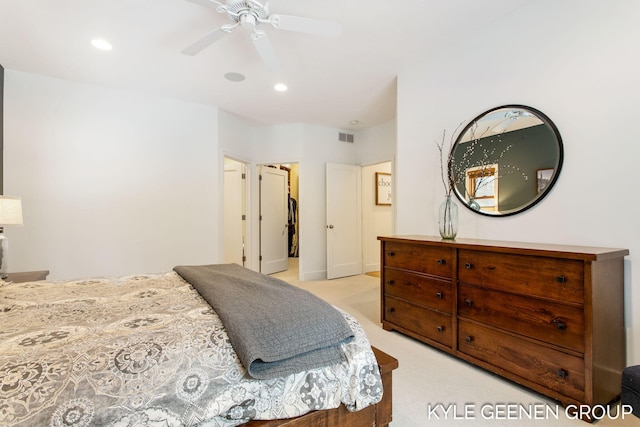 bedroom featuring ceiling fan, recessed lighting, light colored carpet, visible vents, and a spacious closet