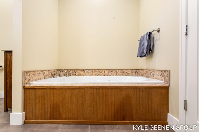 bathroom featuring a garden tub and tile patterned floors