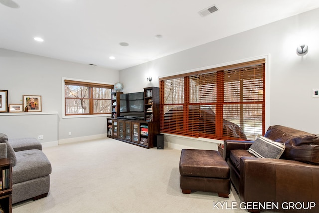 living area with carpet, visible vents, baseboards, and recessed lighting