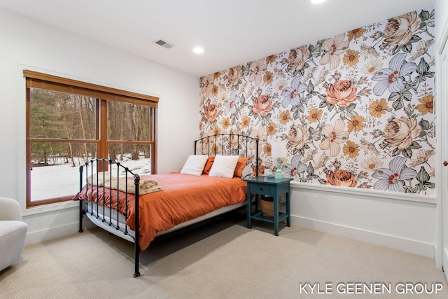 carpeted bedroom featuring recessed lighting, visible vents, and baseboards