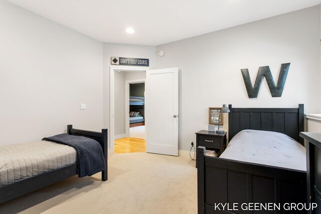 bedroom featuring recessed lighting, baseboards, and light colored carpet