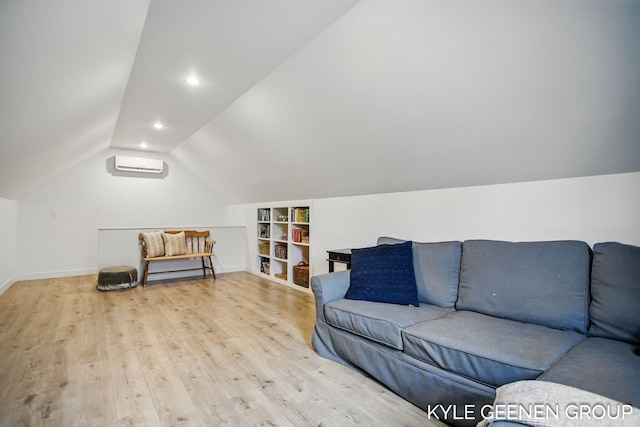 living room featuring a wall unit AC, recessed lighting, vaulted ceiling, wood finished floors, and baseboards