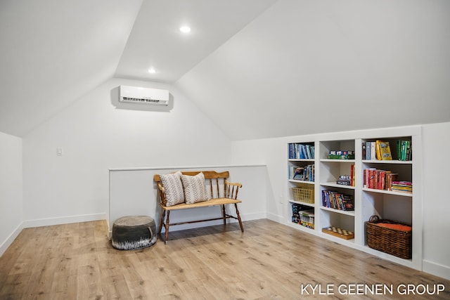 bonus room with vaulted ceiling, an AC wall unit, wood finished floors, and recessed lighting