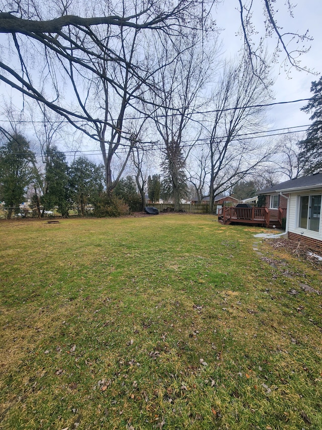 view of yard with a wooden deck