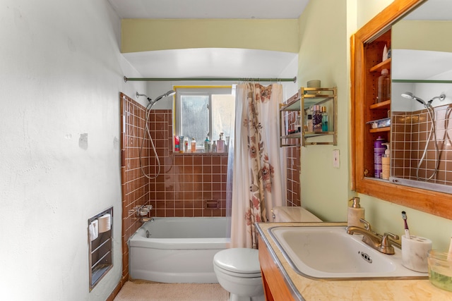 bathroom with toilet, shower / bath combo, and vanity