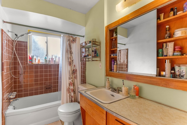 full bathroom with shower / tub combo, vanity, and toilet