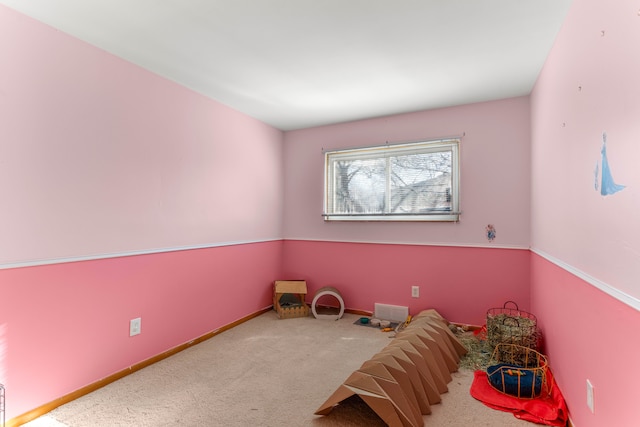 unfurnished bedroom featuring carpet, visible vents, and baseboards