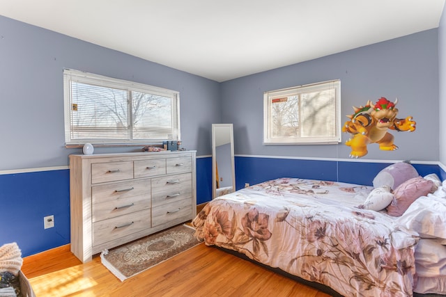 bedroom featuring light wood-style floors