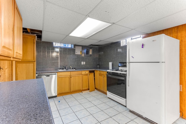 kitchen with a sink, backsplash, freestanding refrigerator, dishwasher, and gas range