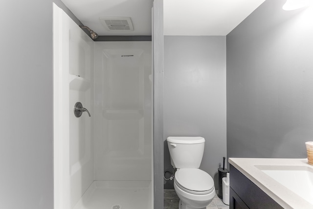 full bath with visible vents, a shower stall, toilet, and vanity