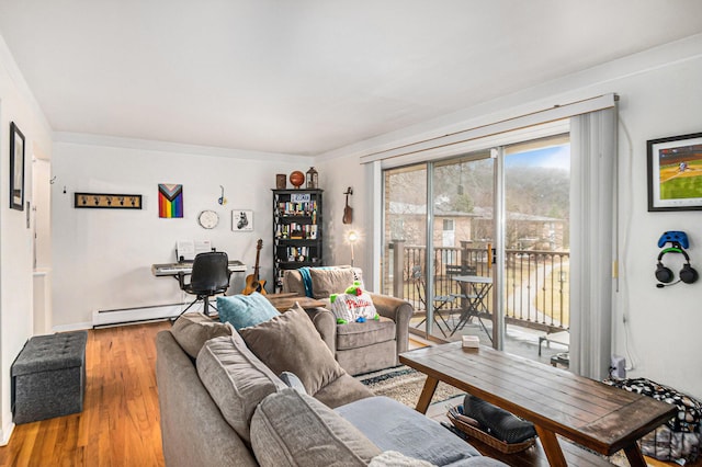 living area with baseboard heating and wood finished floors