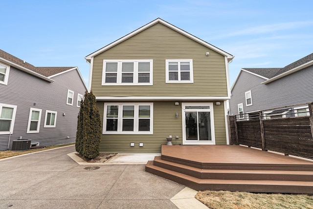 back of house with fence, a patio, a wooden deck, and central air condition unit