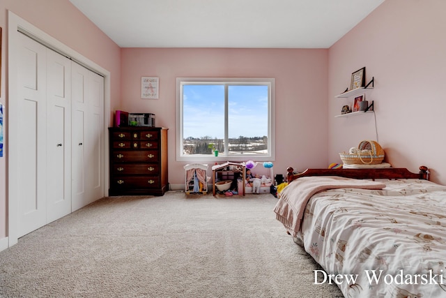 bedroom featuring a closet and carpet flooring