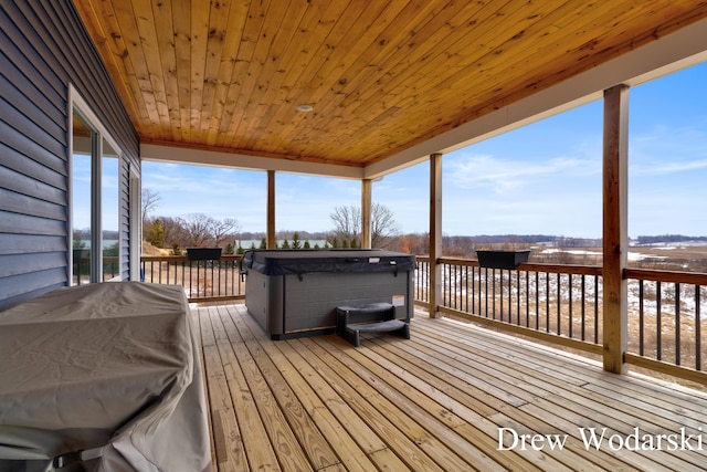 wooden deck featuring a hot tub