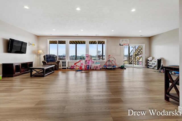 interior space with recessed lighting and wood finished floors