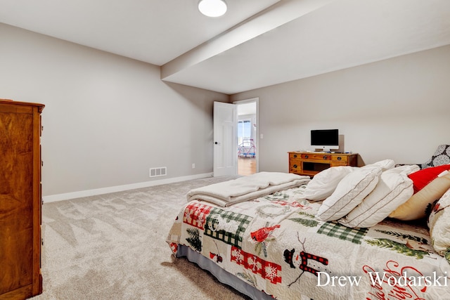 bedroom with carpet, visible vents, and baseboards