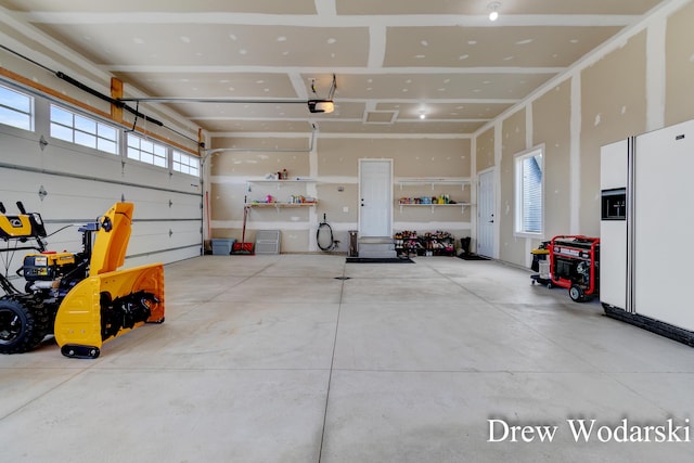 garage with white fridge with ice dispenser and a garage door opener