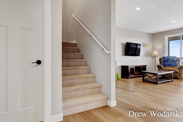 stairs featuring recessed lighting, baseboards, and wood finished floors