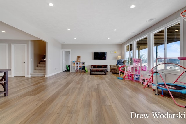 playroom with visible vents, light wood-style flooring, and recessed lighting