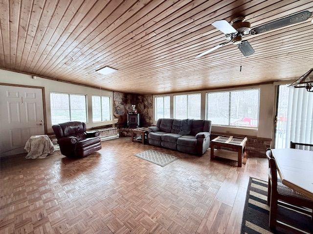 living area featuring parquet floors, wooden ceiling, and plenty of natural light