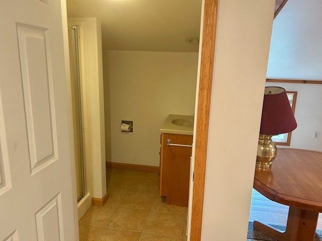 8530 Catherwood Dr, Goodrich, MI 48438 - hallway with baseboards and light tile patterned floors