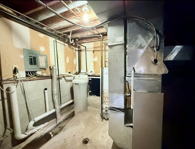 8530 Catherwood Dr, Goodrich, MI 48438 - unfinished below grade area with concrete block wall, heating unit, and electric panel