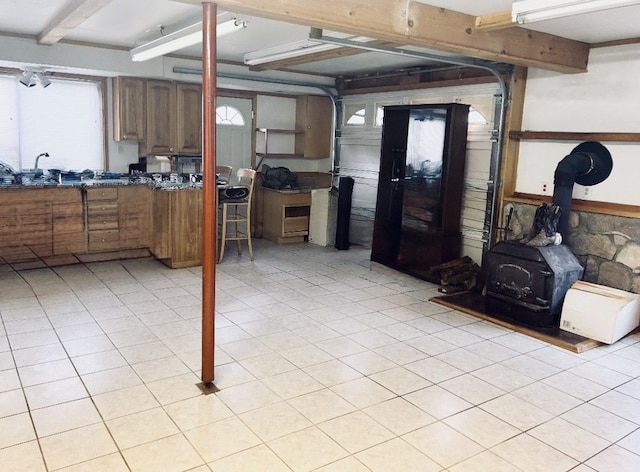 8530 Catherwood Dr, Goodrich, MI 48438 - below grade area with a wood stove and a sink