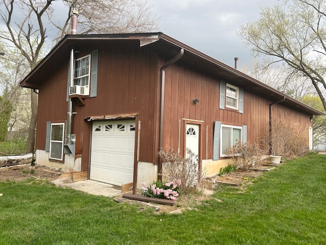 8530 Catherwood Dr, Goodrich, MI 48438 - view of home's exterior with a garage and a lawn