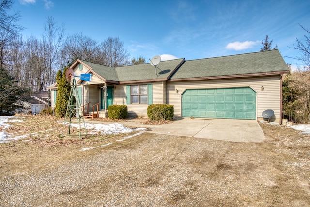 single story home featuring a garage, concrete driveway, and a shingled roof