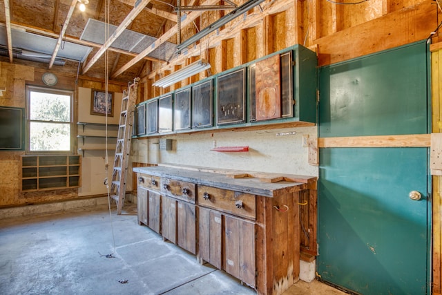 kitchen featuring unfinished concrete floors