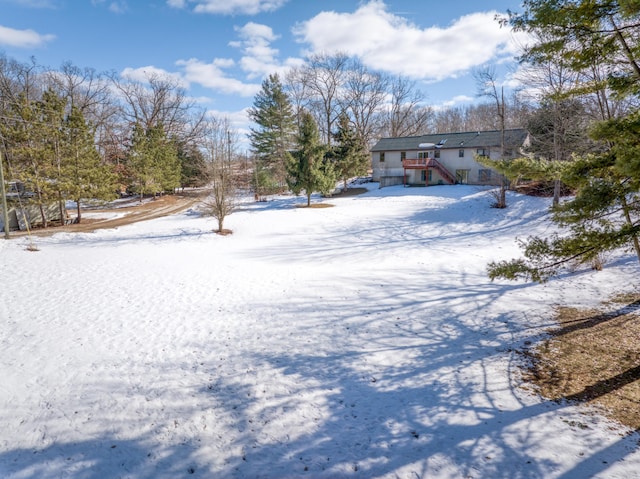 view of yard layered in snow